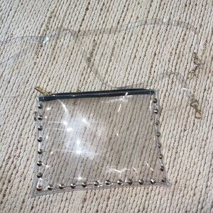 Clearly Handbags envelope style clear bag with gold stud trim